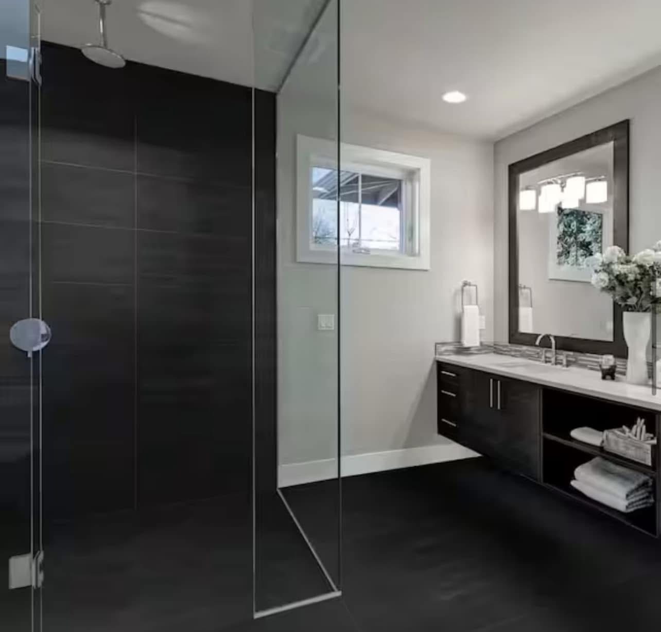 Modern black-and-white bathroom with glass shower