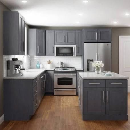 Gray kitchen cabinetry with stainless appliances
