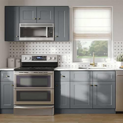 Slate-gray kitchen cabinets and backsplash