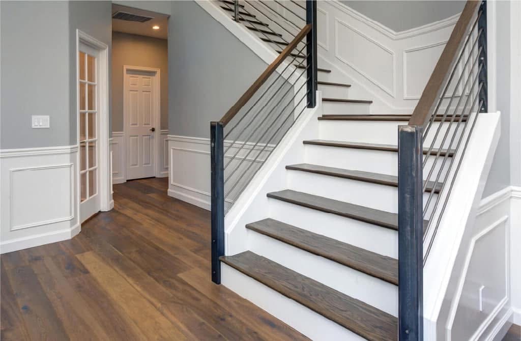 Finished modern staircase with wood treads and metal railing